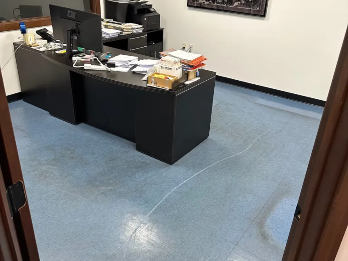 Dull blue VCT office floor before stripping