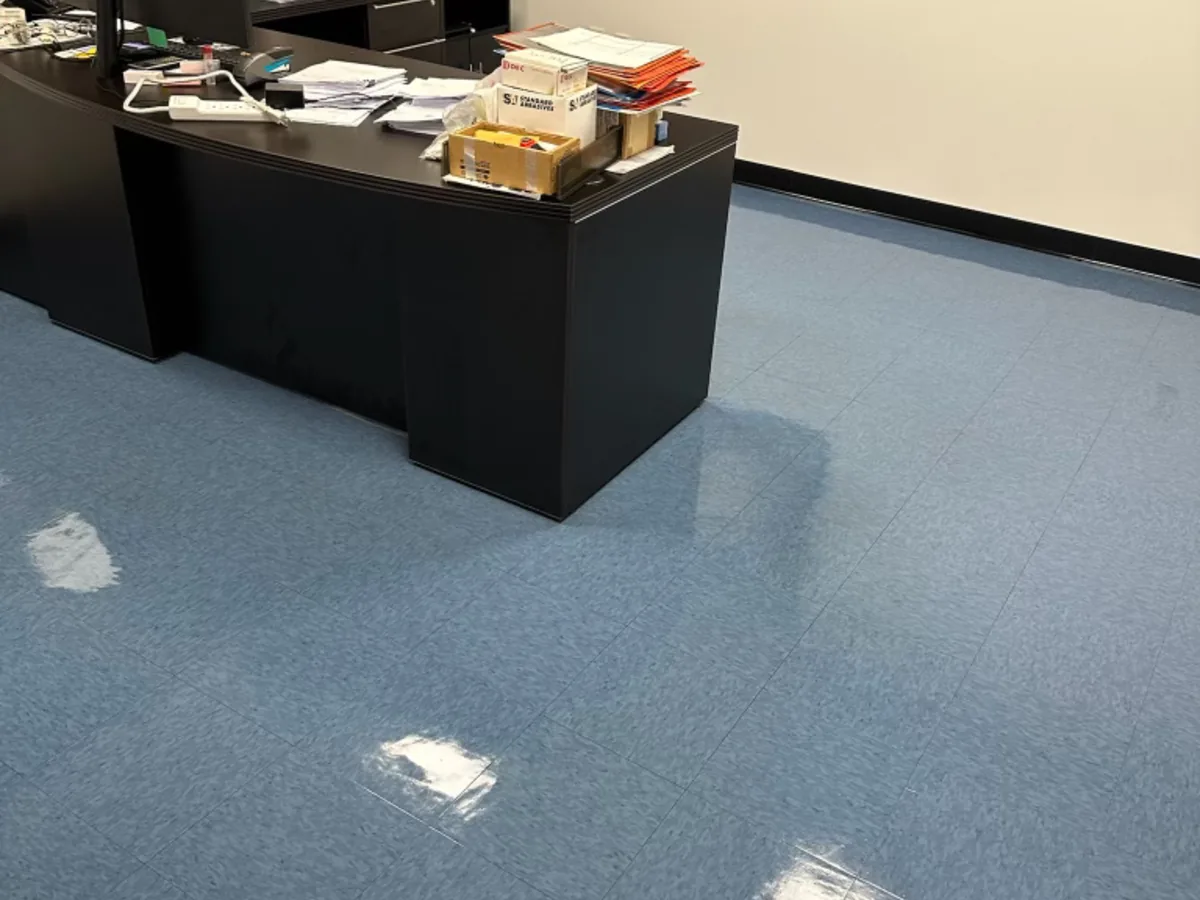 Waxed blue VCT floor in a private office