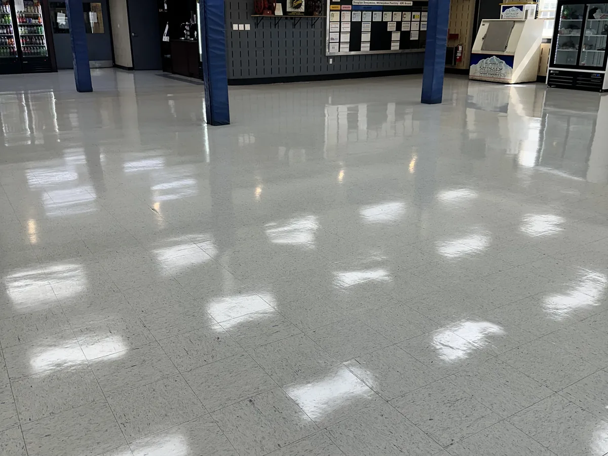 Buffed white VCT showroom floor with high gloss